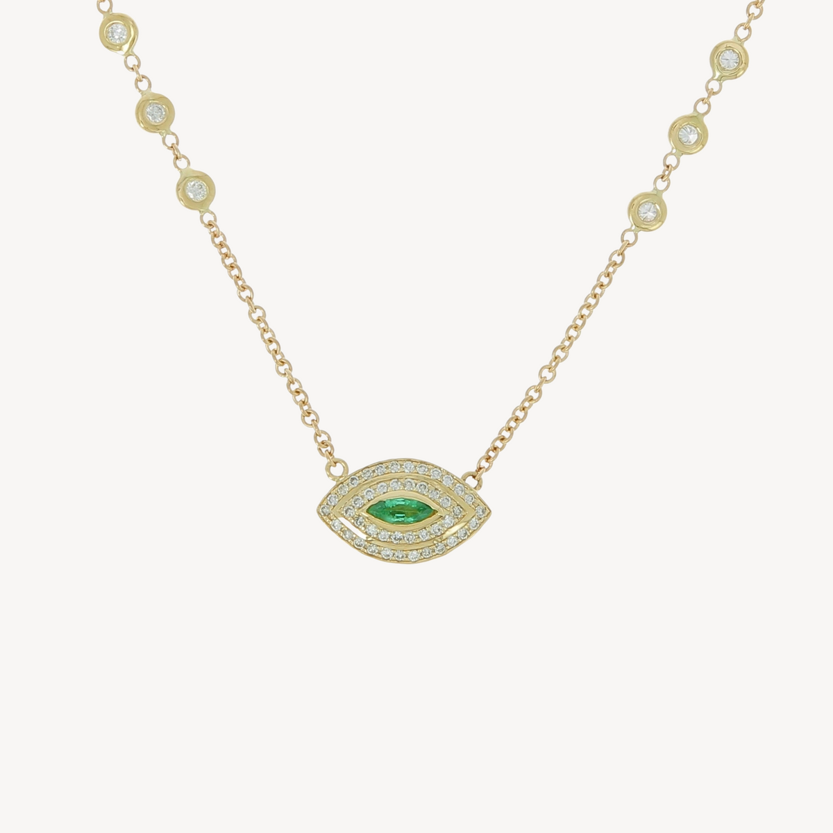 Emerald center halo eye necklace