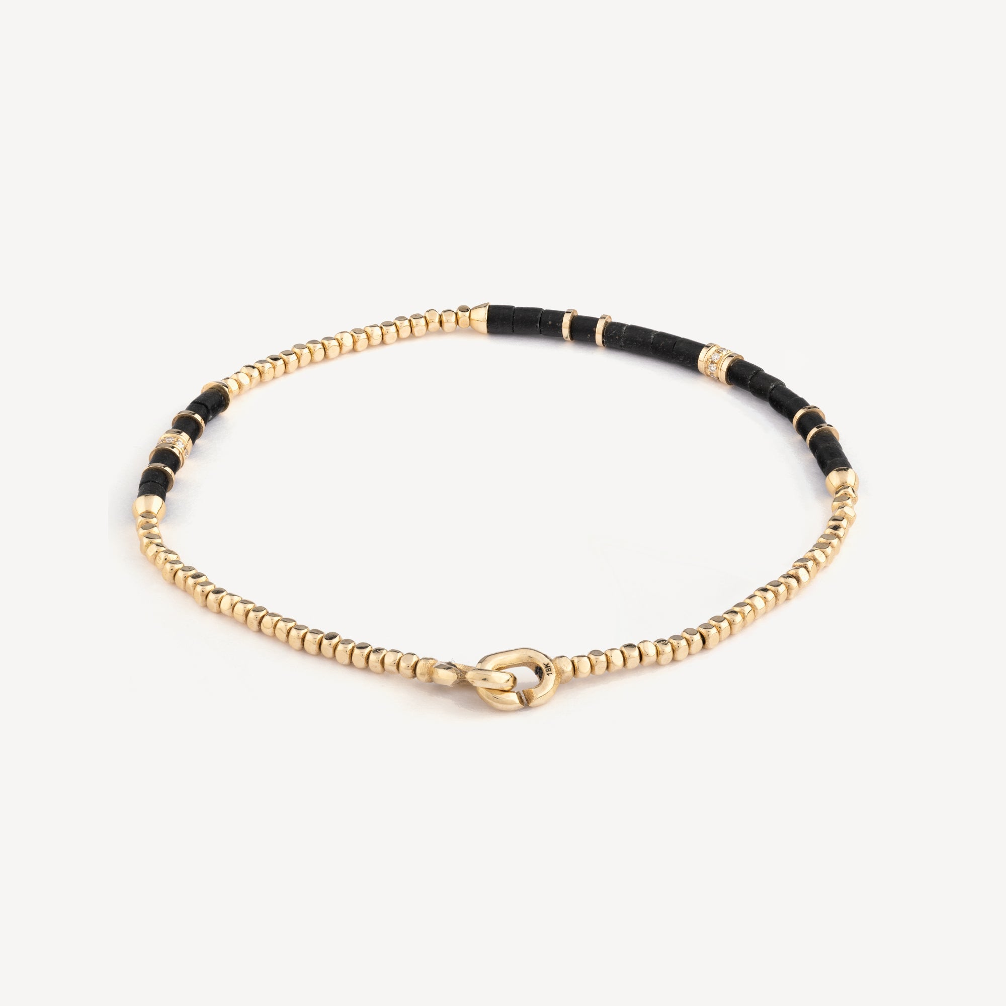 Black afghan creosote yellow gold bracelet