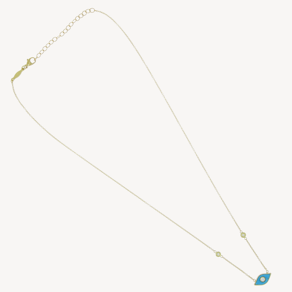 Yellow gold diamond center turquoise eye necklace